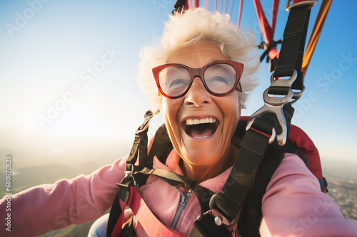 portrait of funny senior woman on parachute