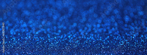 Blurred navy blue sparkling background from small sequins, macro. Shiny sapphire bokeh of backdrop. photo