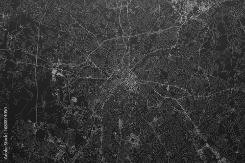 Street map of Charlotte (North Carolina, USA) on black paper with light coming from top photo