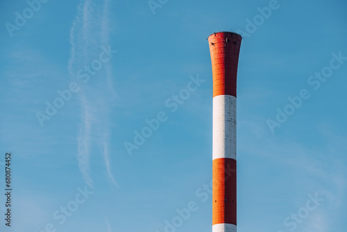 Heating plant chimney against autumn cold sky photo