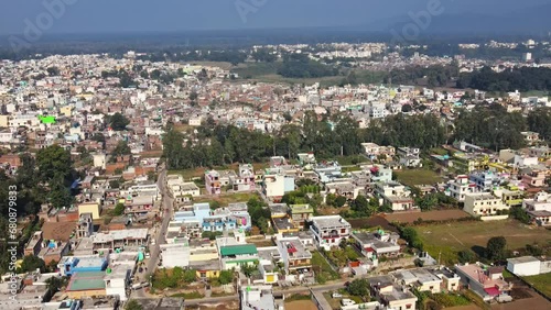 4k Aerial view of All India Institute for Medical Sciences (AIIMS), Rishikesh, India. Drone view of AIIMS in Rishikesh with holy Ganges river flowing along. A sunny day in Rishikesh city.  photo