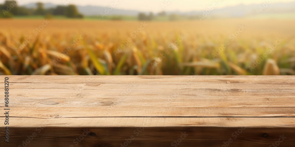 Wooden surface with a blurred cornfield in the background. The concept combines nature with potential display use. Wooden surface with a blurred cornfield in the background. The concept combines nature with potential display use.