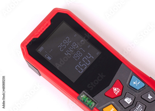 Modern laser distance measurer on a white background