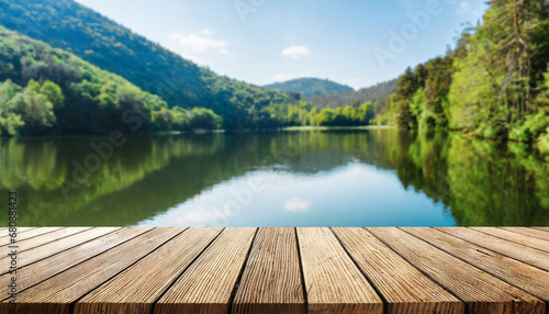 Empty wooden table top with blur background of summer lakes. For product showing