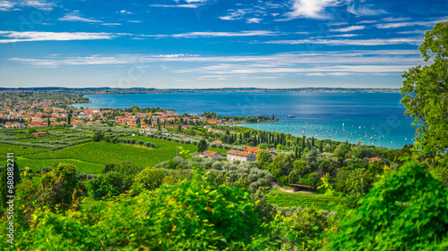 Italy, Veneto, Bardolino, View of village on shore of Lake Garda in summer photo