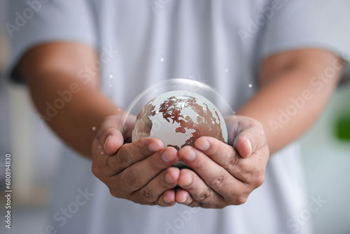 Crystal globe on hand. Environmental ESG concept. Society and Governance Sustainable global environment concept. Ecology. Conservation. Environmental concept. Green business or investment