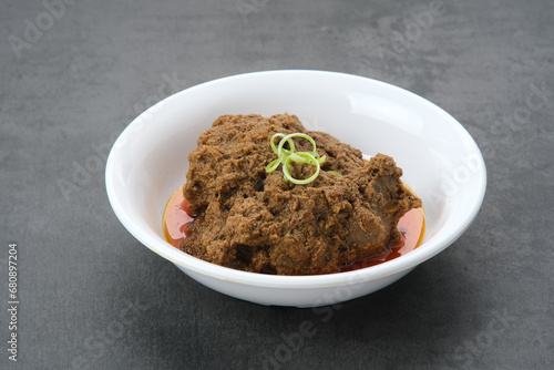 Rendang Daging Sapi  traditional food from Padang  Indonesia. Beef stew with spices  herbs and coconut milk 