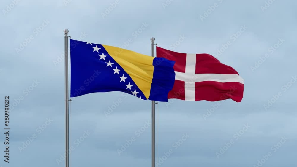 Denmark flag and Bosnia and Herzegovina flag waving together on cloudy sky, endless seamless loop, two country relations concept Denmark flag and Bosnia and Herzegovina flag waving together on cloudy sky, endless seamless loop, two country relations concept