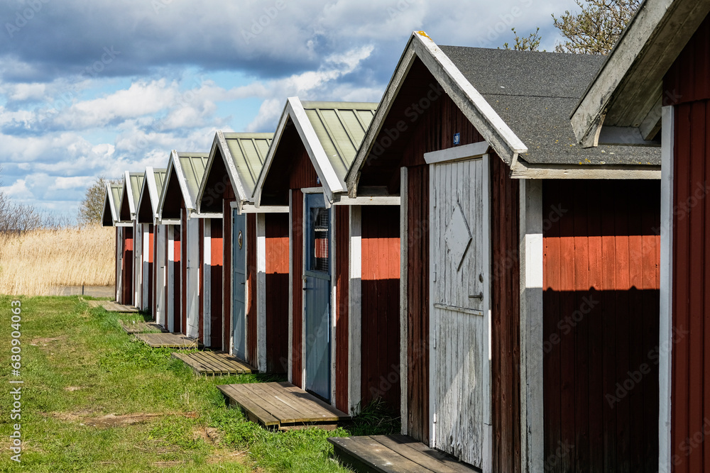 Fishing sheds in a row under clouds Fishing sheds in a row under clouds