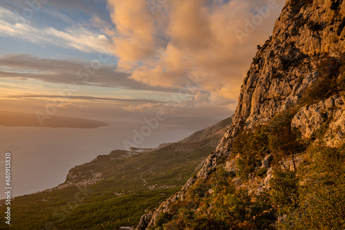 Spectacular landscape of the rocky coastline on the Makarska Riviera during a stormy sunset