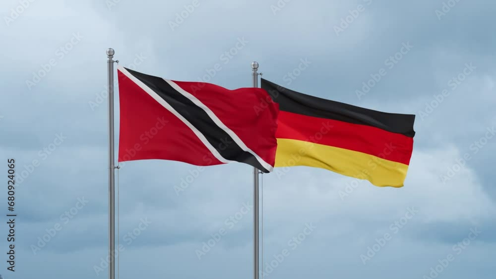 Germany flag and Trinidad and Tobago flag waving together on cloudy sky, endless seamless loop, two country relations concept Germany flag and Trinidad and Tobago flag waving together on cloudy sky, endless seamless loop, two country relations concept
