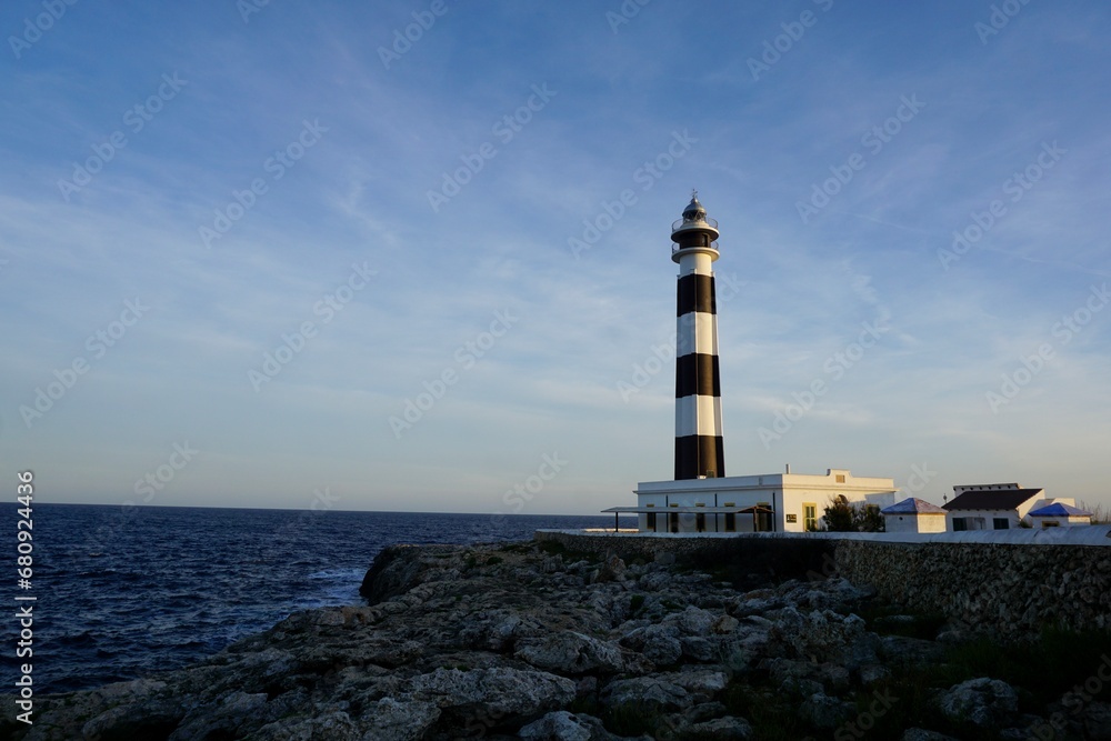 Mediterranean lighthouse on a seashore in Menorca