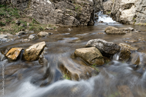 Calderones del Infierno canyon landscape in the north of Spain with silky water effect photo