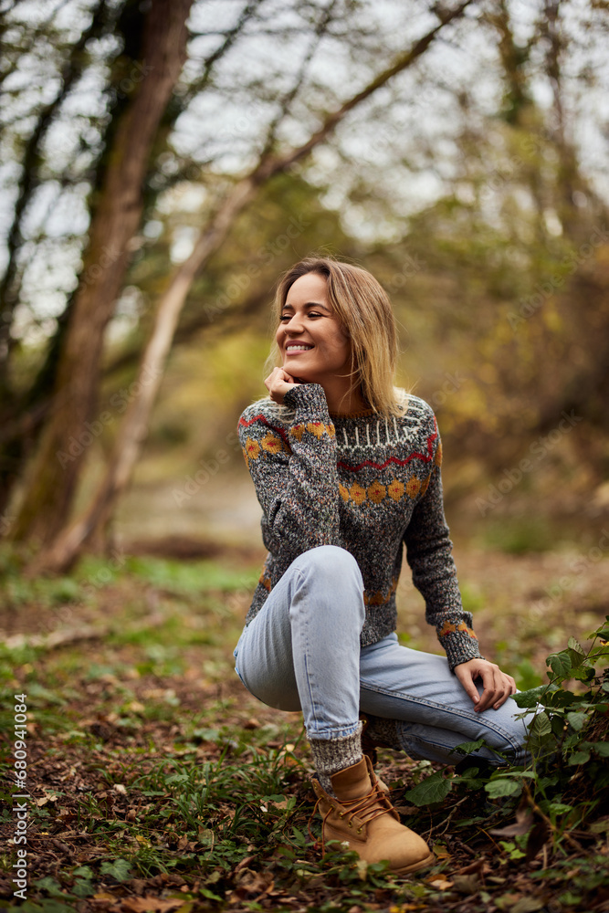 A smiling girl, spending the day outdoors, looking on the side, laughing. A smiling girl, spending the day outdoors, looking on the side, laughing.