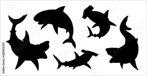 Set with sharks silhouettes: great white shark, megalodon, mako and hammerhead shark. Vector illustration to cut out and glue.	