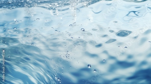 White water with ripples on the surface. Defocus blurred transparent white colored calm calm water surface texture with splashes and bubbles. Shiny pattern texture background with water waves