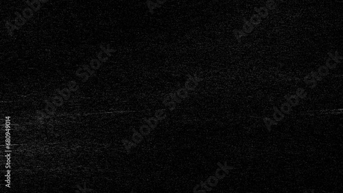 Black and white gradient noise grain background texture.