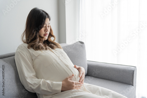 worried pregnant woman concerned and anxious woman in pregnancy overthinking worrying about pregnancy problem Pregnancy depression Mental health photo