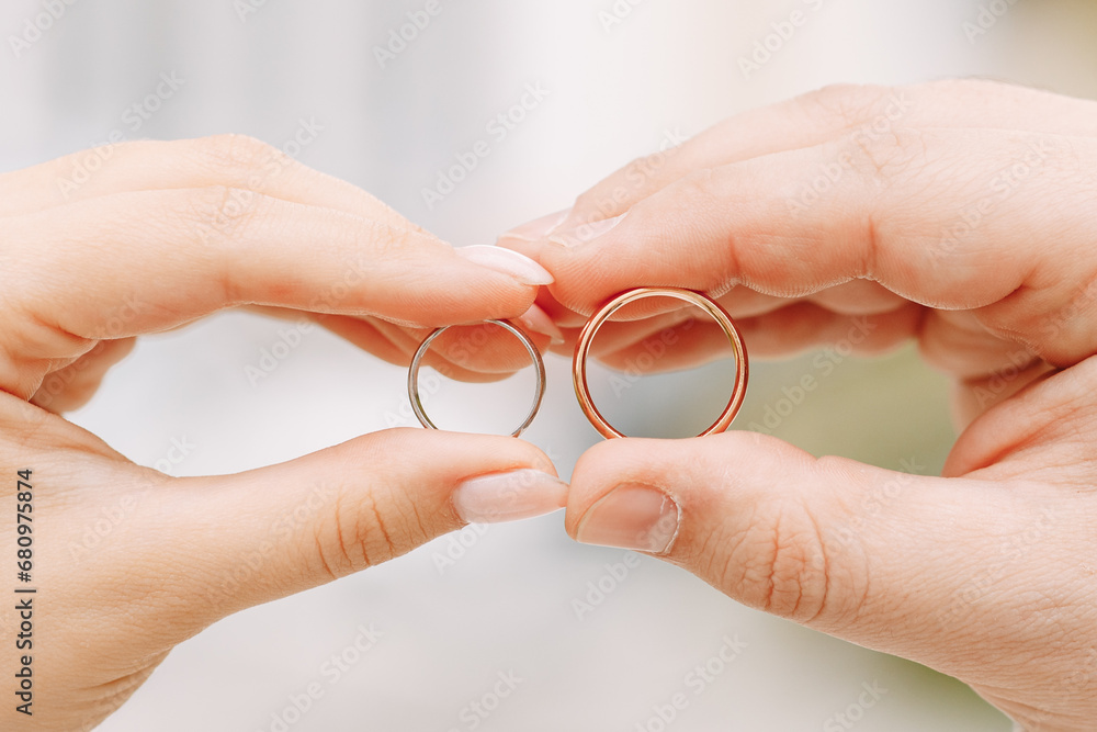 Newlyweds exchange rings, groom puts the ring on the bride's hand. Newlyweds exchange rings, groom puts the ring on the bride's hand.