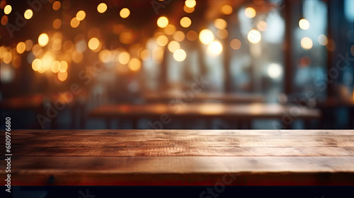 Wooden Table with Blurred Restaurant or Cafe Background and Bokeh Effect © aznur