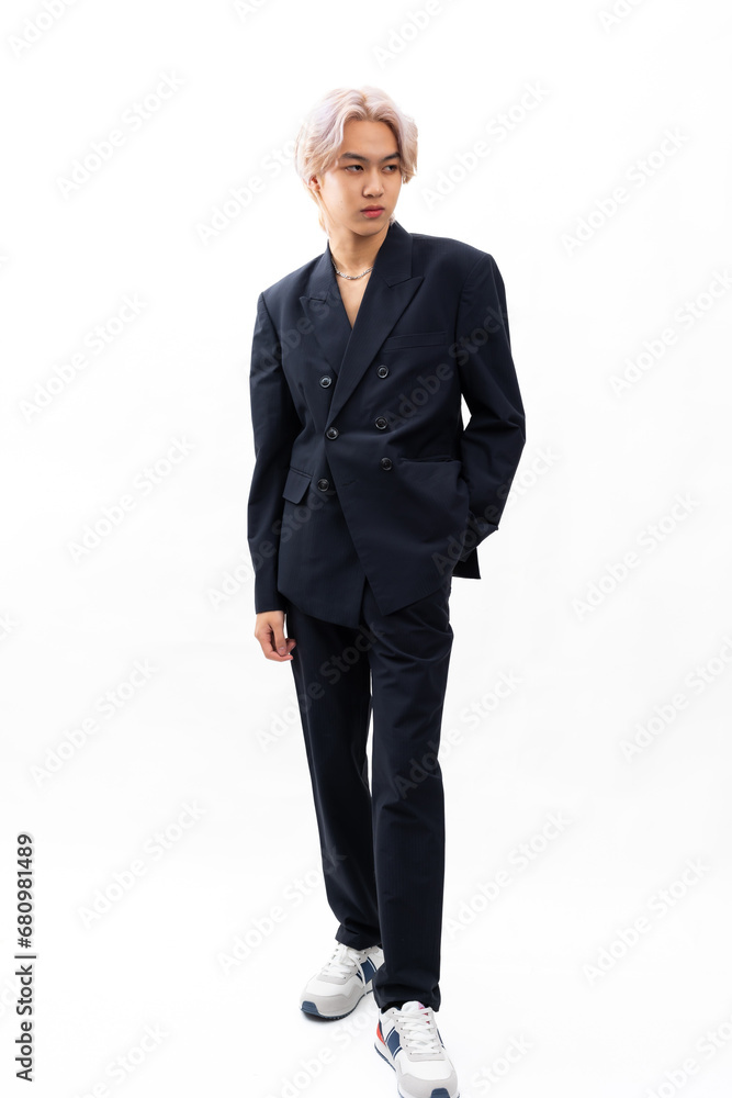 black suit and naked torso. Fashion portrait Asian young man. model, clothing and cosmetics. Young male model blond hair in fashionable clothing isolated on white background black suit and naked torso. Fashion portrait Asian young man. model, clothing and cosmetics. Young male model blond hair in fashionable clothing isolated on white background