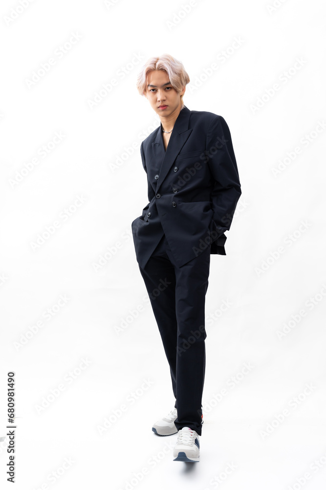 black suit and naked torso. Fashion portrait Asian young man. model, clothing and cosmetics. Young male model blond hair in fashionable clothing isolated on white background black suit and naked torso. Fashion portrait Asian young man. model, clothing and cosmetics. Young male model blond hair in fashionable clothing isolated on white background