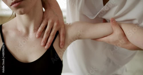 Wallpaper Mural Physiotherapist treating wrist, shoulder and back of patient examined in hospital, Healthcare Concept in the professional clinic Torontodigital.ca