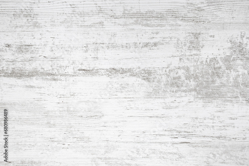 White table top with gray veins imprint, weathered wood backdrop, abstract texture