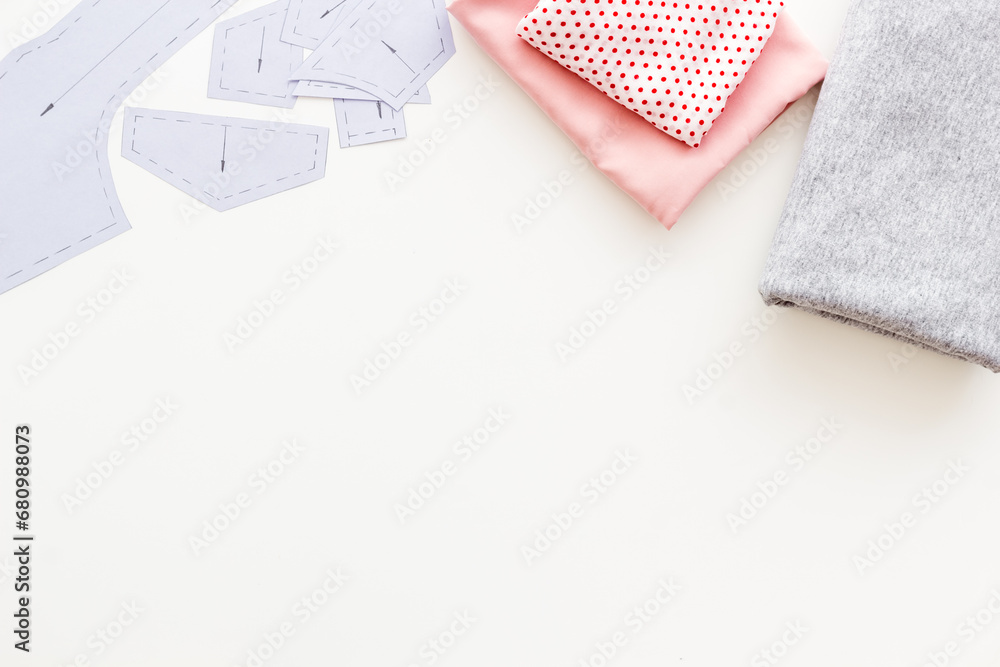 Fototapeta premium Cotton dress fabric with skein of thread on fashion designer dressmaker table