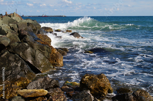 Waves crash on a rocky shore