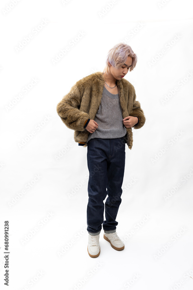 winter faux fur coat. Fashion portrait Asian young man. model, clothing and cosmetics. Young male model fashion lifestyle in fashionable clothing on isolated white background winter faux fur coat. Fashion portrait Asian young man. model, clothing and cosmetics. Young male model fashion lifestyle in fashionable clothing on isolated white background