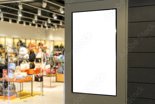 Vertical LED TV Screen at Front of fashion bag store in Shopping Mall. photo