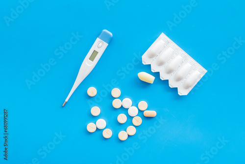 Thermometer with rectal suppositories and pills for medical treatment