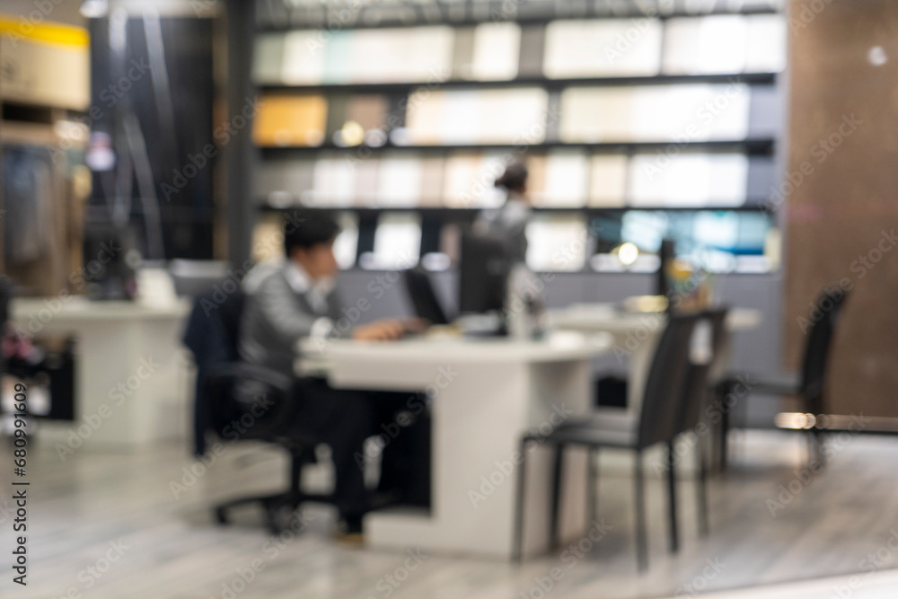 Blur image of modern office with businessman working at desk. Blur image of modern office with businessman working at desk.
