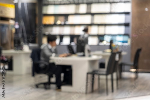 Blur image of modern office with businessman working at desk. © pixs4u
