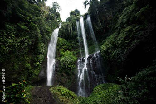 Fototapeta Naklejka Na Ścianę i Meble -  View of jungle waterfall cascade in tropical rainforest