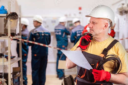 Man foreman. Worker scratch...