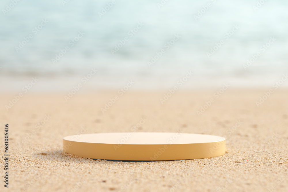 Beige platform on the beach for standing product against the ocean background Beige platform on the beach for standing product against the ocean background
