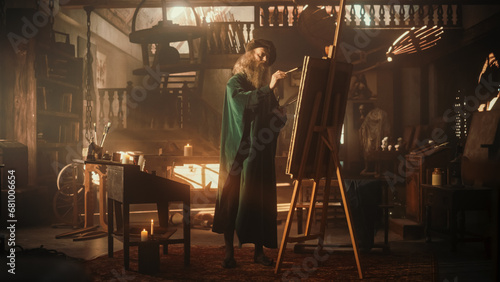 Fotografie Wide Shot of Old Male Renaissance Artist Painting on Canvas in his Antique Workshop