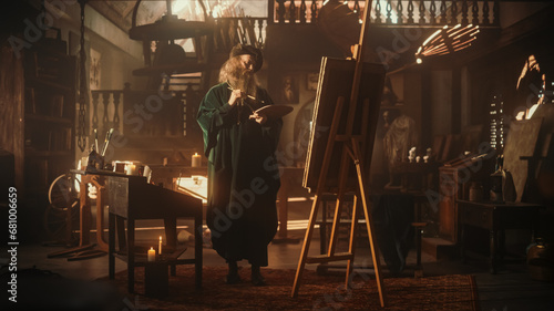Photo Renaissance Era Concept: Inspired Senior Male Painter Adding Details to his Painting on Canvas