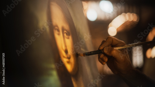 Close Up on Male Painter Hand Painting the Mona Lisa with Gentle Brush Movement. Details of the Famous Painting Being Drawn by its Creator. Pure Talent and Mastery of High Art, Everlasting Beauty photo