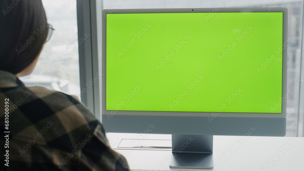 Woman reading chromakey computer at city view flat. Student watching monitor Woman reading chromakey computer at city view flat. Student watching monitor