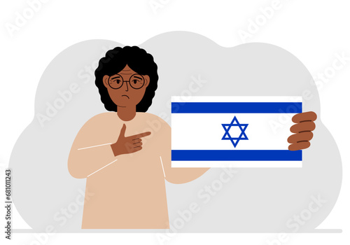 A Jewish woman holds an Israeli flag. Vector