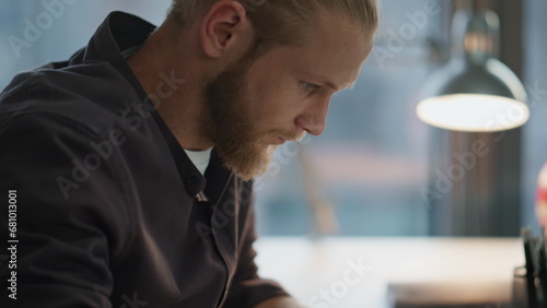 Serious man fingers texting keyboard office closeup. Freelancer working laptop