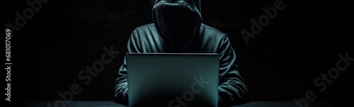 Man in a hoodie in front of a laptop, illustration of a hacker on black background. Generative AI