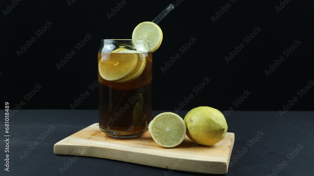 Fototapeta premium Glass of tasty Long Island iced tea on dark background with space for text