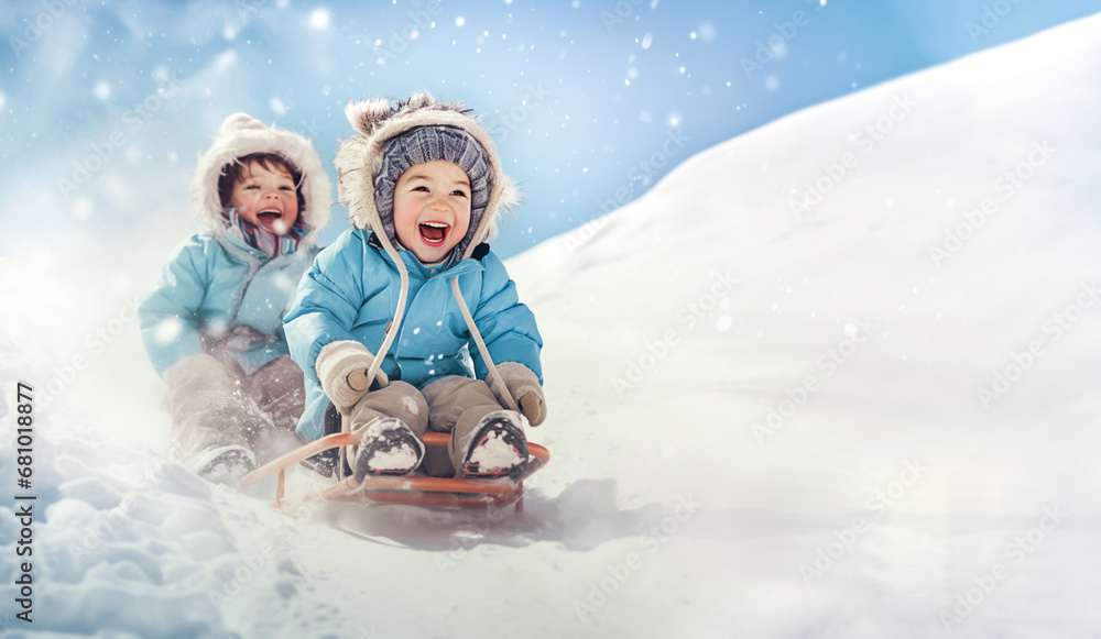 two happy children ride down a slide in winter. place for text