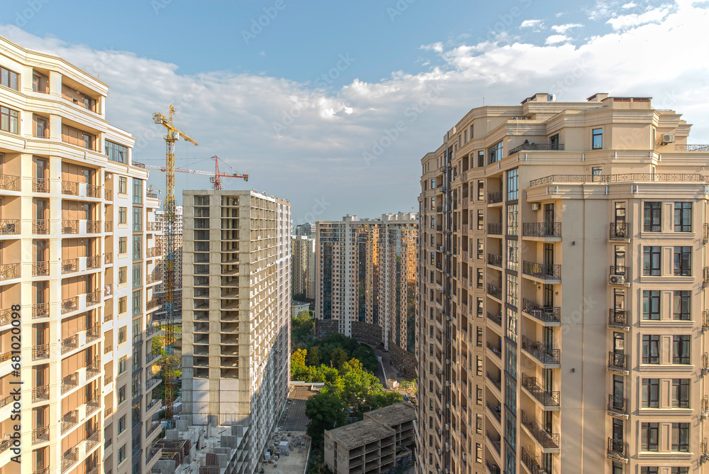 Panorama of new residential buildings in the distance, construction of new high-rise buildings, panorama of a modern city on a fine summer day Panorama of new residential buildings in the distance, construction of new high-rise buildings, panorama of a modern city on a fine summer day
