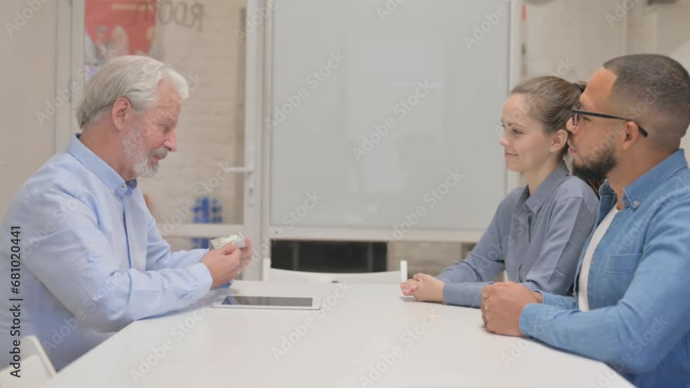 Senior Real Estate Agent Shaking Hand after Getting Money Senior Real Estate Agent Shaking Hand after Getting Money
