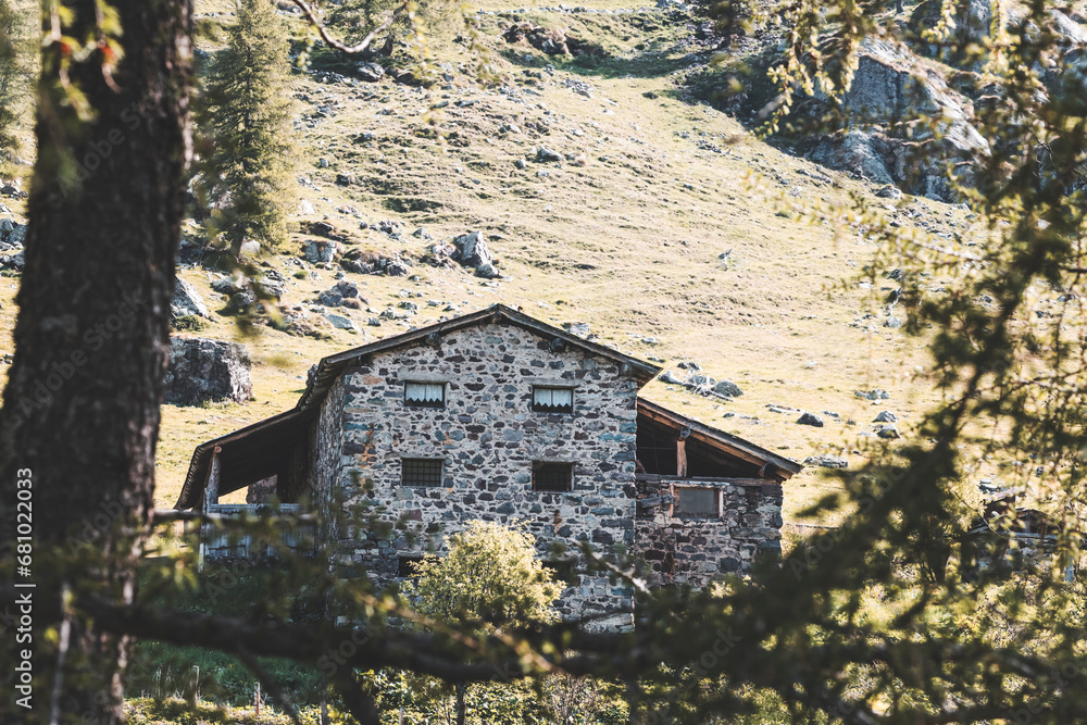 old stone house in the mountains on a spring day